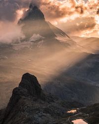 Scenic view of mountains against sky during sunset