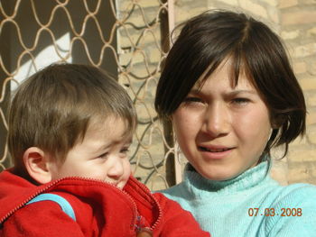 Portrait of mother and daughter outdoors