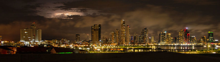 Illuminated buildings in city at night