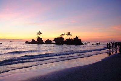 Scenic view of beach against sky during sunset