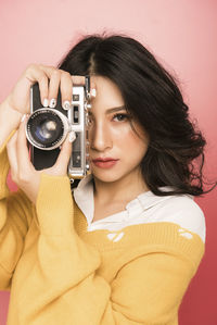 Portrait of woman photographing
