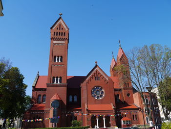 Low angle view of church against blue sky
