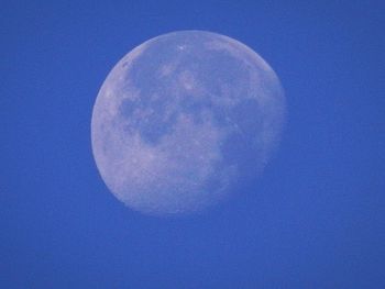 Close-up of moon against blue sky