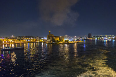 Illuminated buildings in city at night