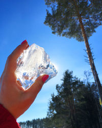 Cropped hand holding ice cream cone
