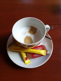 High angle view of coffee cup on table