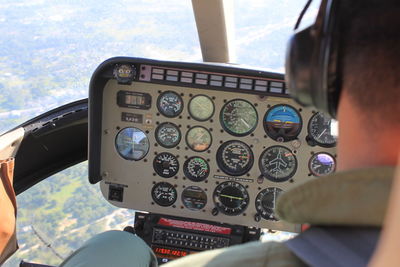 Rear view of man on airplane window