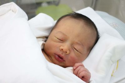 Cute baby sleeping in bed