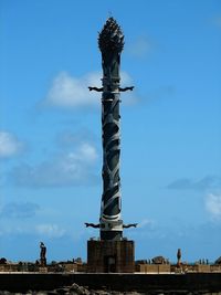 Low angle view of built structure against blue sky