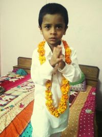 Portrait of boy standing at home