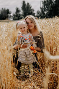 Two women standing on field