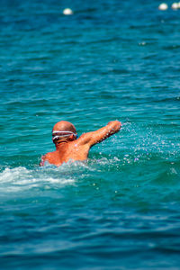 Man swimming in sea