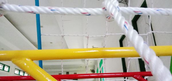 Low angle view of clothespins hanging on clothesline