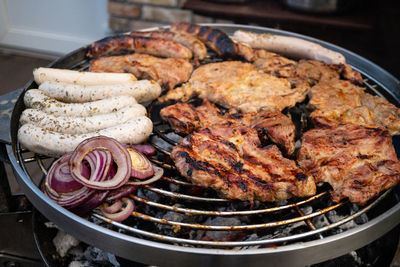 High angle view of meat on barbecue grill