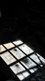 High angle view of shadow on floor