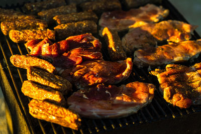 High angle view of meat on barbecue grill