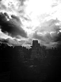 Low angle view of historic building against cloudy sky