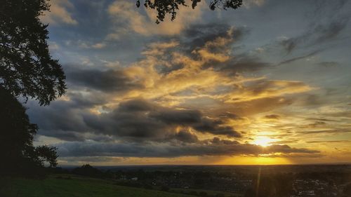 Scenic view of landscape against sky at sunset