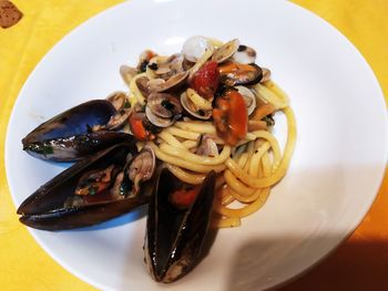 High angle view of fruits in plate on table