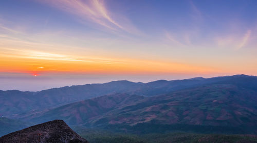 Scenic view of mountains against sky during sunset