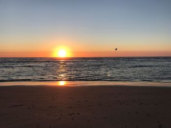 Scenic view of sea against sky during sunset