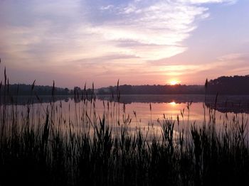 Scenic view of lake at sunset