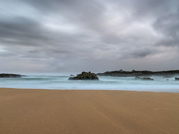 Scenic view of beach against sky