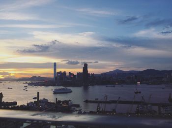 Illuminated cityscape at sunset