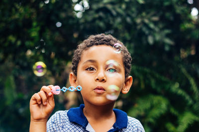 Portrait of boy with bubbles