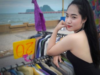 Close-up of girl standing by sea