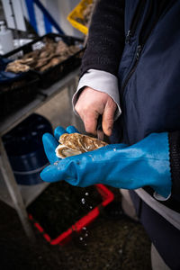 Midsection of man preparing food