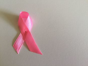 High angle view of pink paper on table