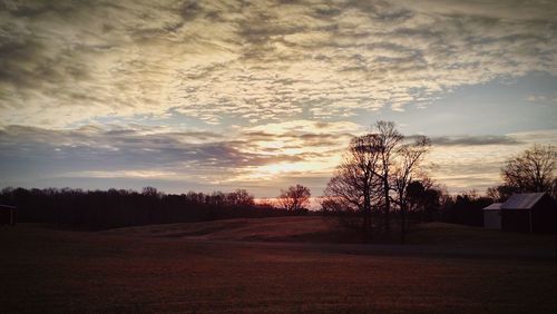 Scenic view of landscape against cloudy sky