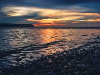 Scenic view of sea at sunset