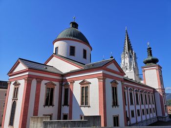 Low angle view of building against blue sky