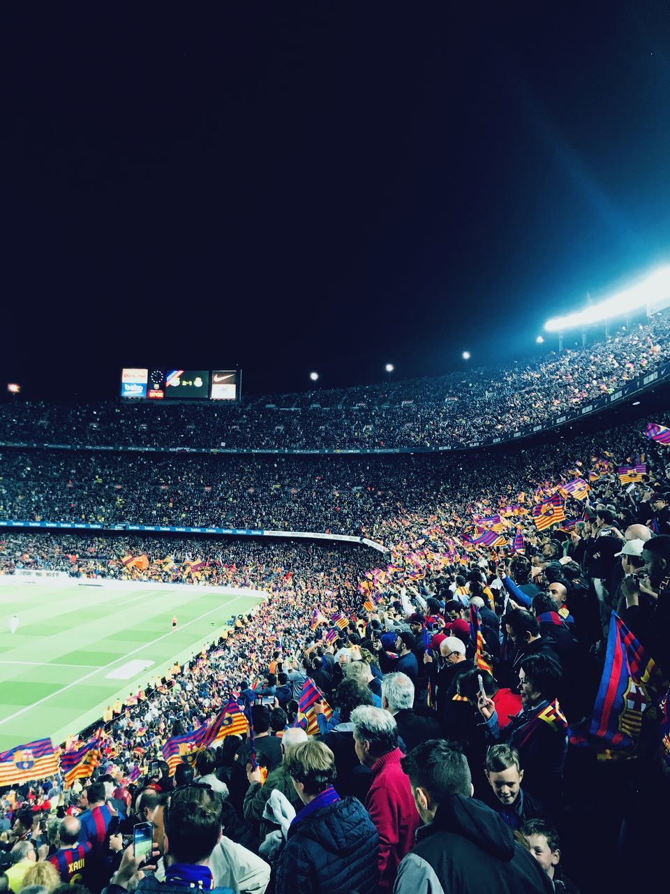 HIGH ANGLE VIEW OF PEOPLE ON SOCCER FIELD