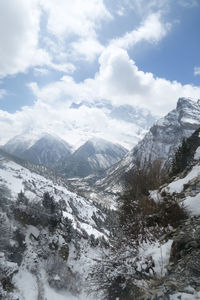 Scenic view of snowcapped mountains against sky