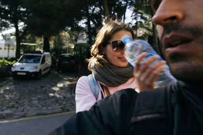 Cropped image of man with woman on street