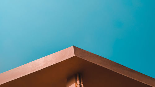 Low angle view of building against blue sky