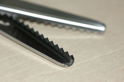 Close-up of metal on table