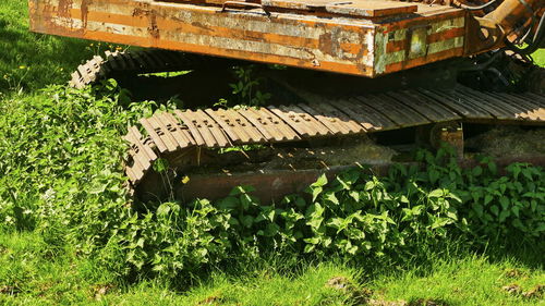 View of abandoned car on land