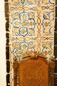 Close-up of ornate window on wall of building