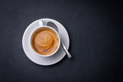 Directly above shot of coffee cup on table