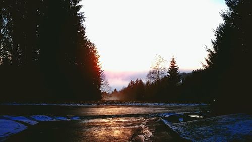 Scenic view of landscape against clear sky during winter