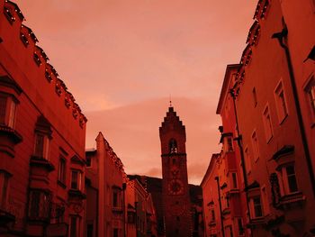 Low angle view of built structure against sky at sunset