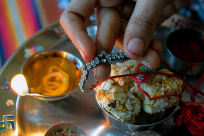 Close-up of person holding food