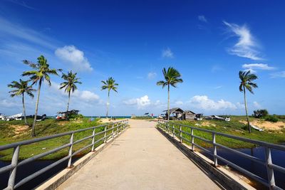 Scenic view of beach against clear blue sky
