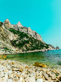 Scenic view of sea against clear blue sky