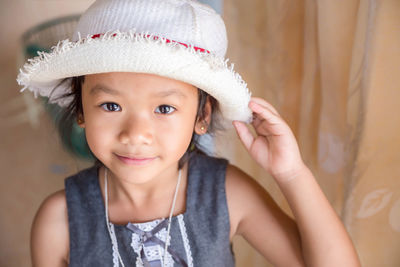 Portrait of cute girl wearing hat