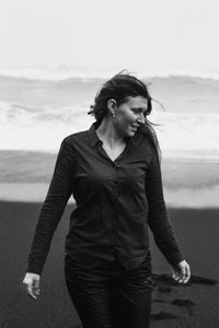 Smiling lady on reynisfjara beach monochrome scenic photography